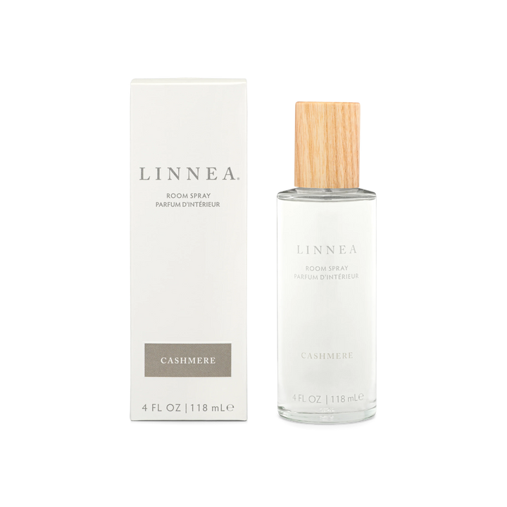 Linnea cashmere room spray bottle next to its packaging