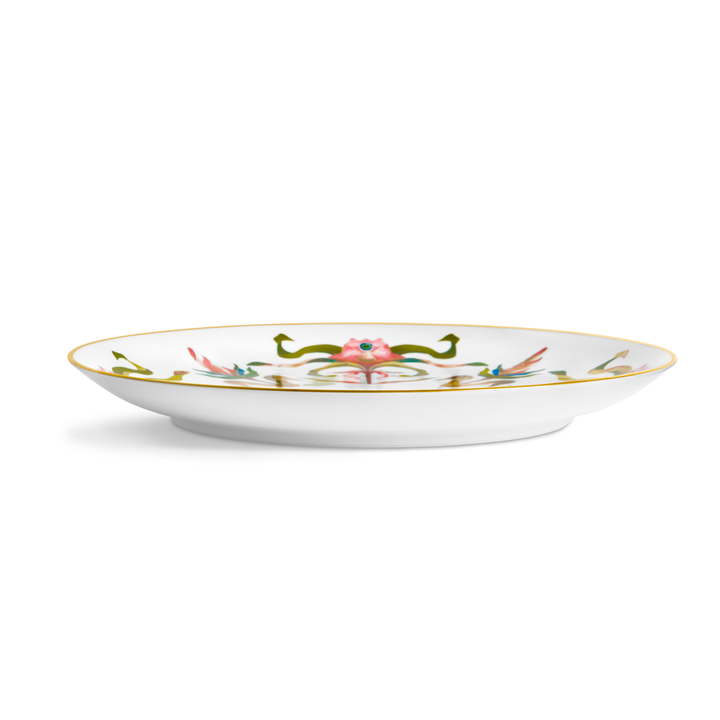 A white porcelain plate with painted floral and a gold rim