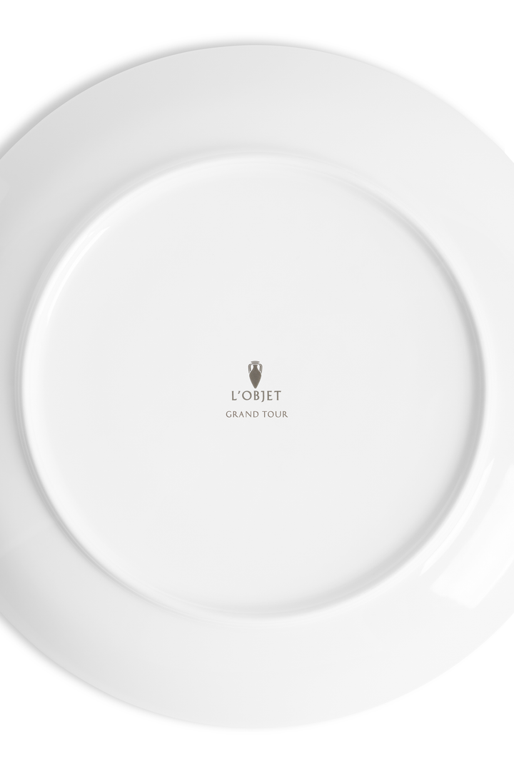 The underside of a white plate with the L'Objet logo