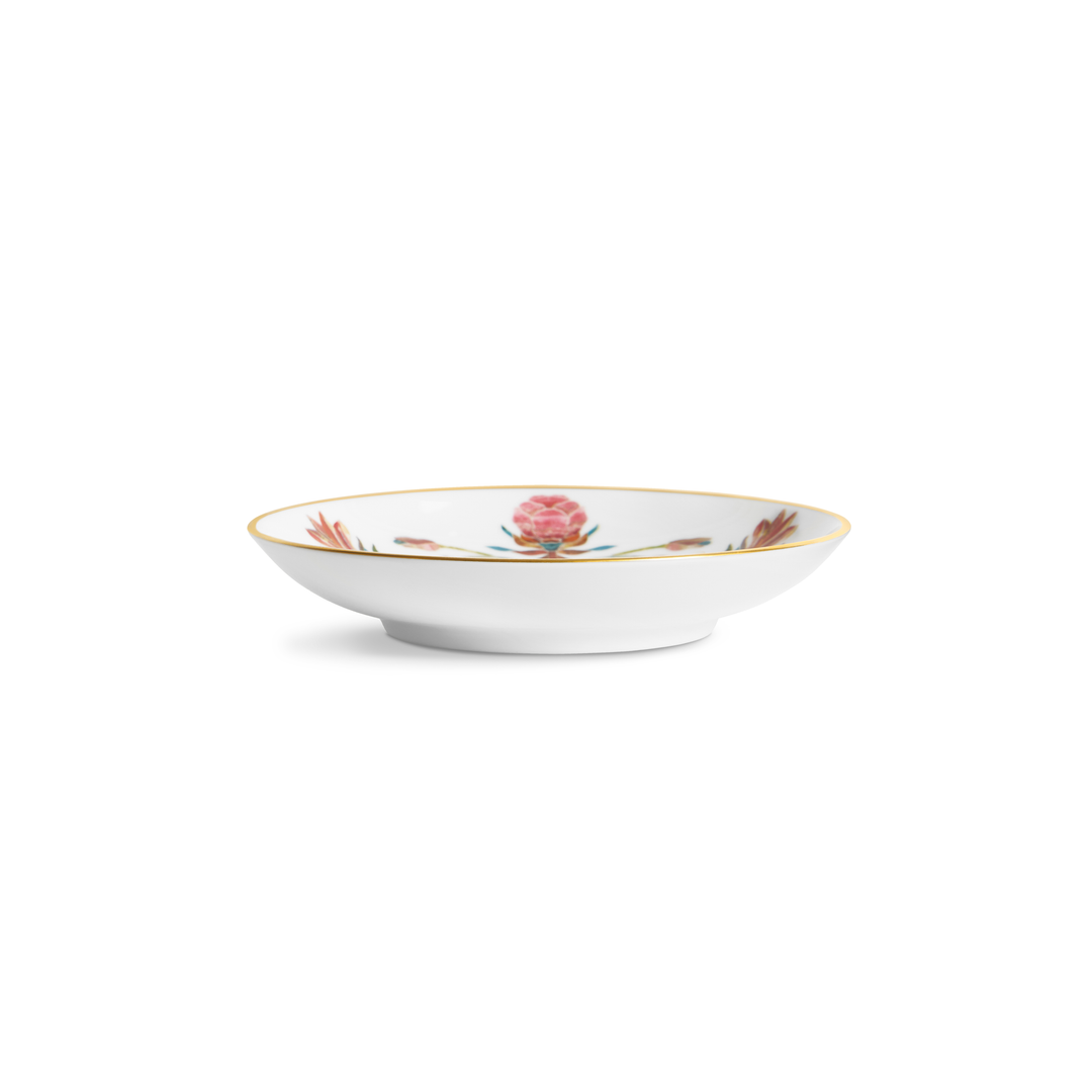 A small white saucer with a painted floral design and a gold rim