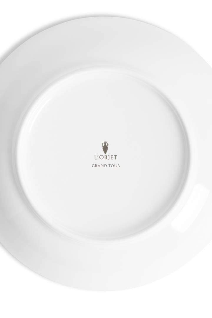 The white underside of a porcelain dish with the L'Objet logo and the words "grand Tour" inscribed