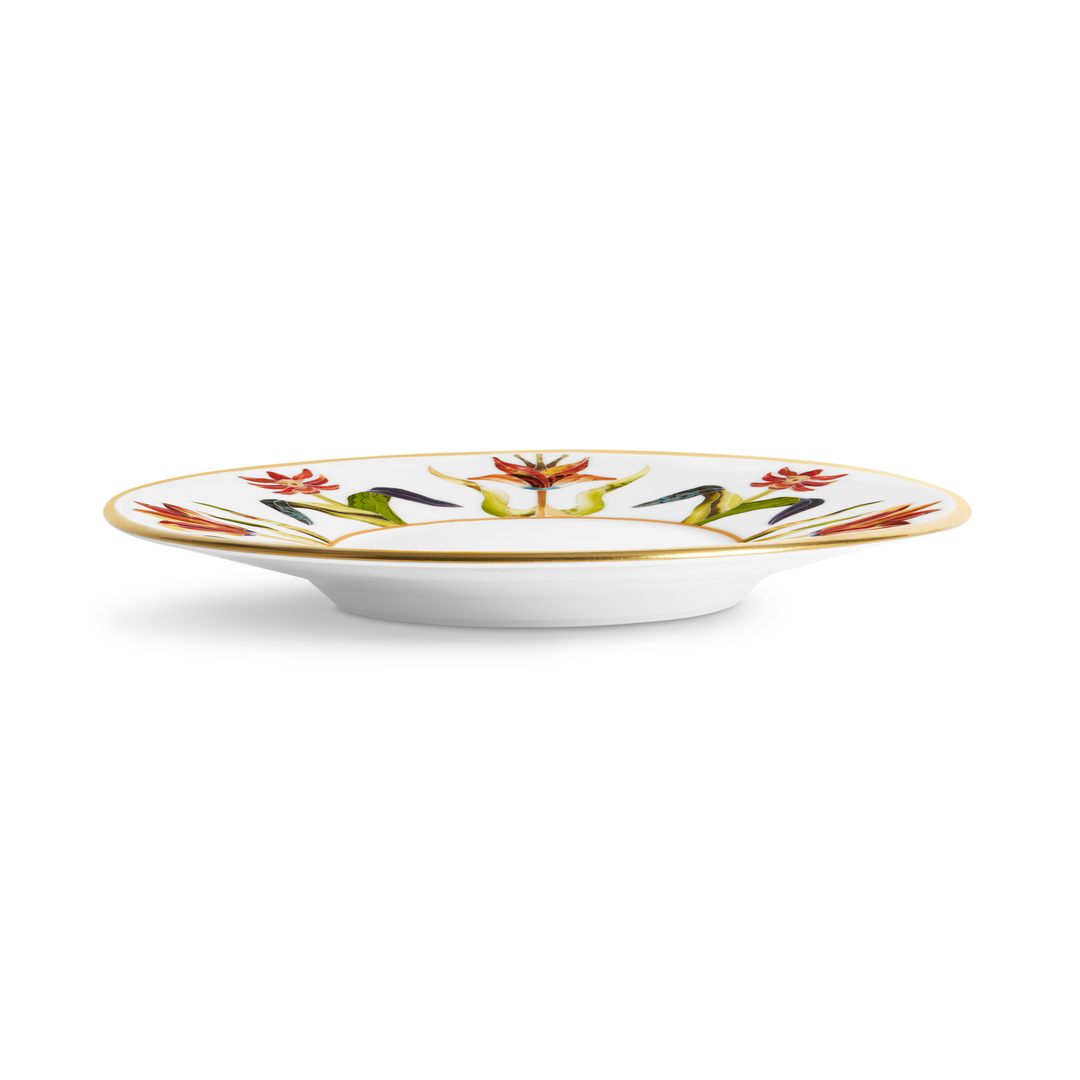 A white plate with floral designs and a gold rim