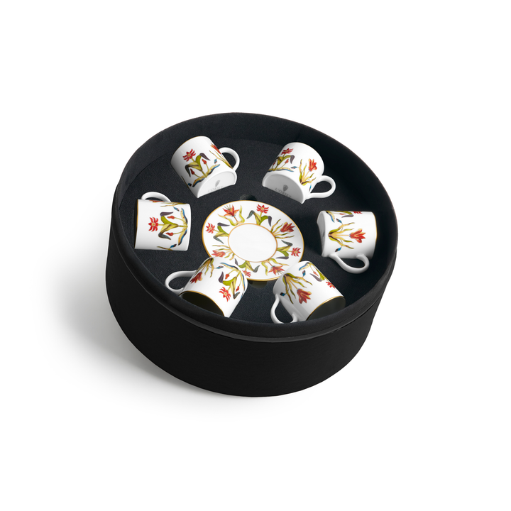 A set of six porcelain coffee cups and matching dishes painted with a floral design