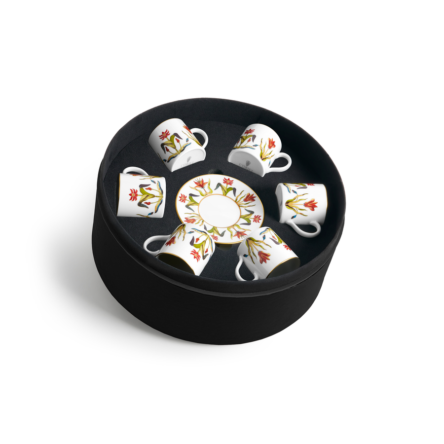 A set of six porcelain coffee cups and matching dishes painted with a floral design