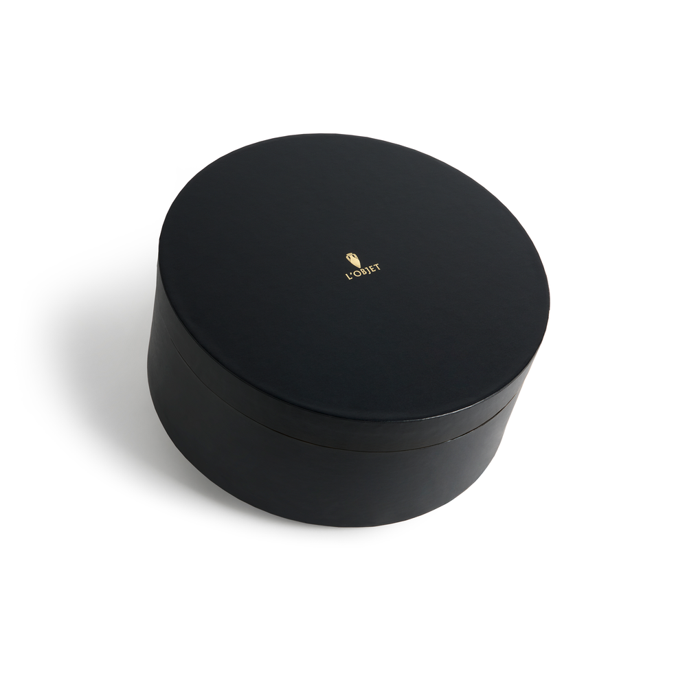 A black round box with the L'Objet logo in gold foil