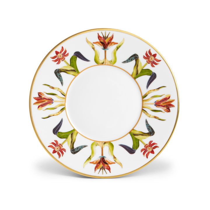The top view of a white porcelain dish painted with flower motifs along the lip and a gold trim on the edges