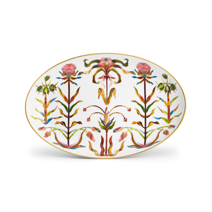 A porcelain oval platter with a painted floral pattern and a gold rim