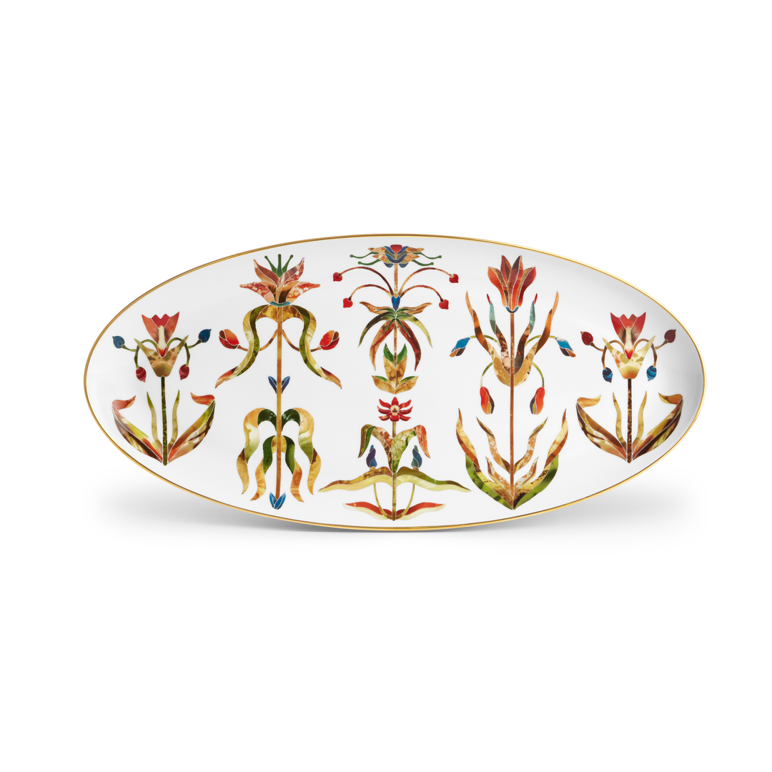 A white porcelain platter with  a gold rim and painted floral figures