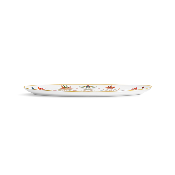 A side view of a white porcelain platter with a gold rim and painted flowers