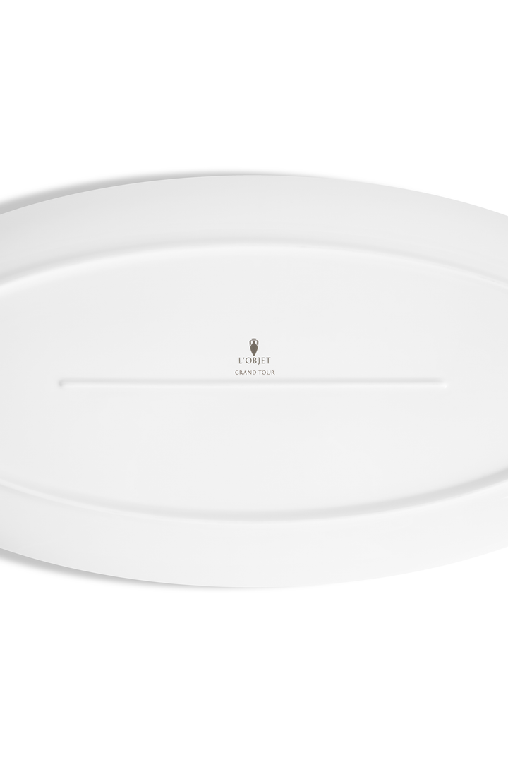 the bottom of a porcelain platter with the L'Objet logo and the words "rand TOur" imprinted