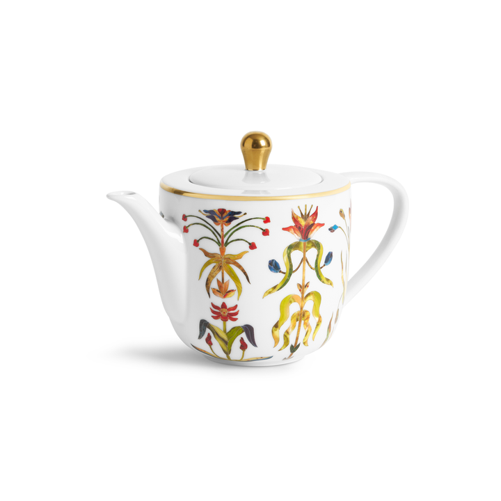 A white porcelain teapot with painted floral motifs and gold accents