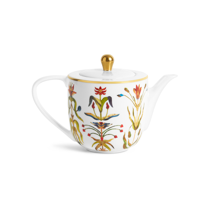 A porcelain teapot painted with floral motifs and a gold rim and knob on hte lid