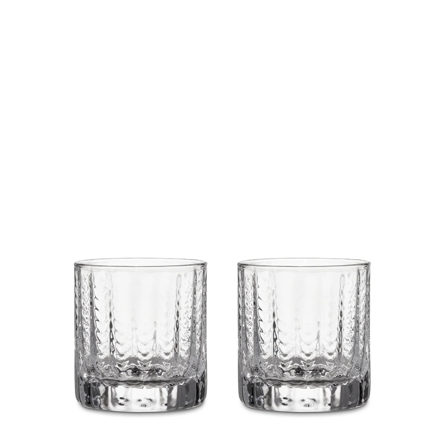Two clear textured glass tumblers with thick bases, shown side by side on a plain white background.