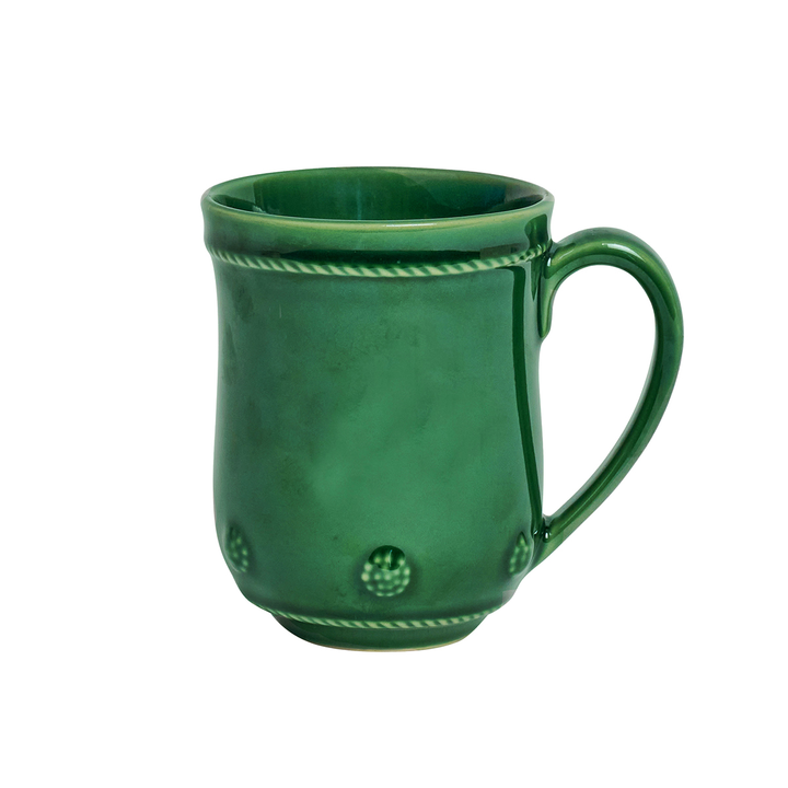 Green ceramic mug with decorative patterns 