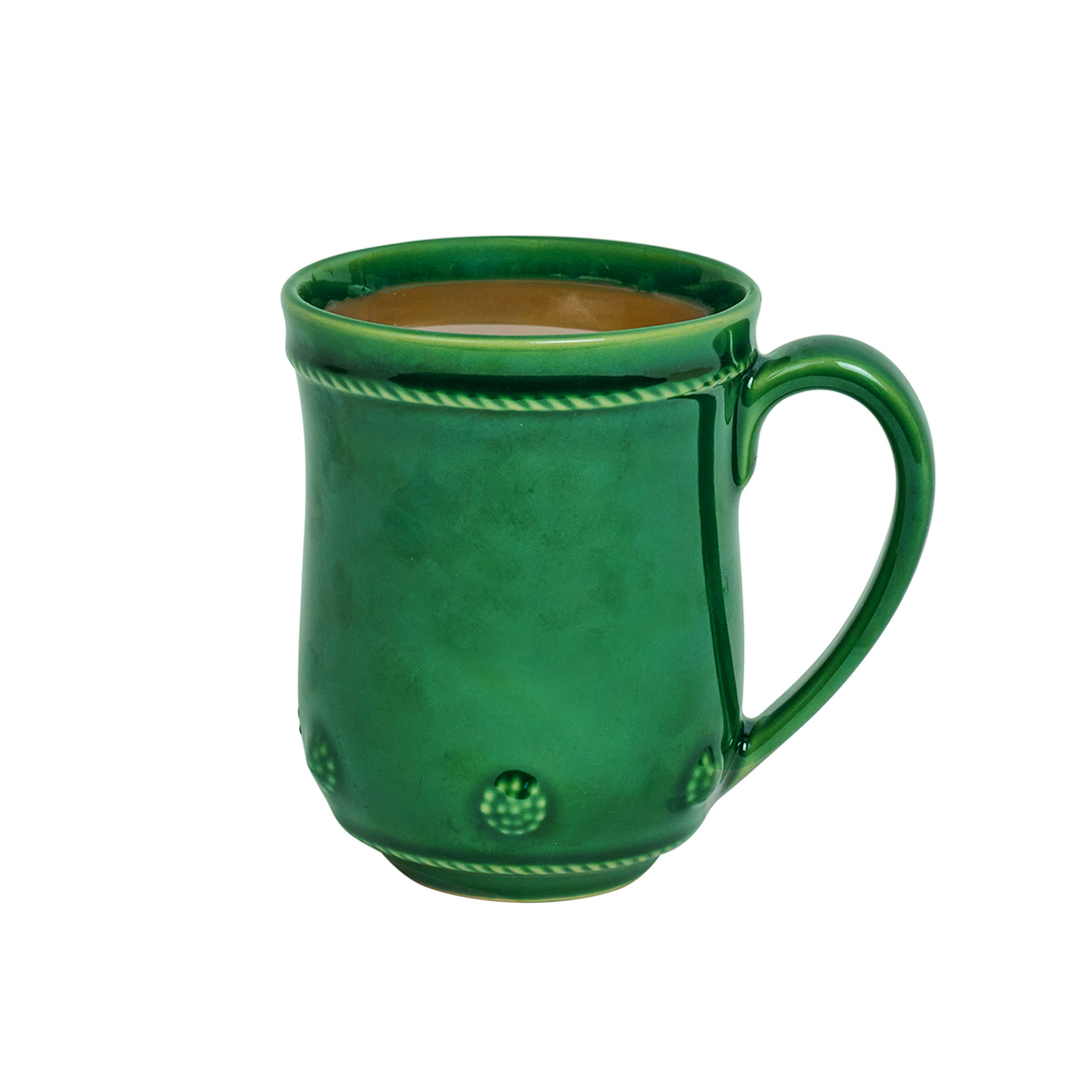 A green ceramic mug with a handle, featuring decorative raised dots and rope-like trim details