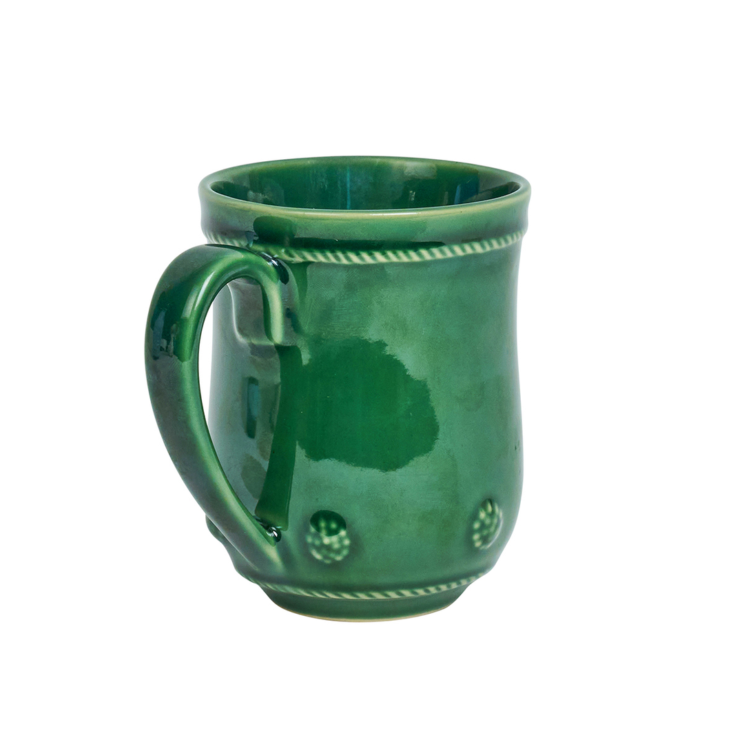 Green ceramic mug with decorative patterns on a white background