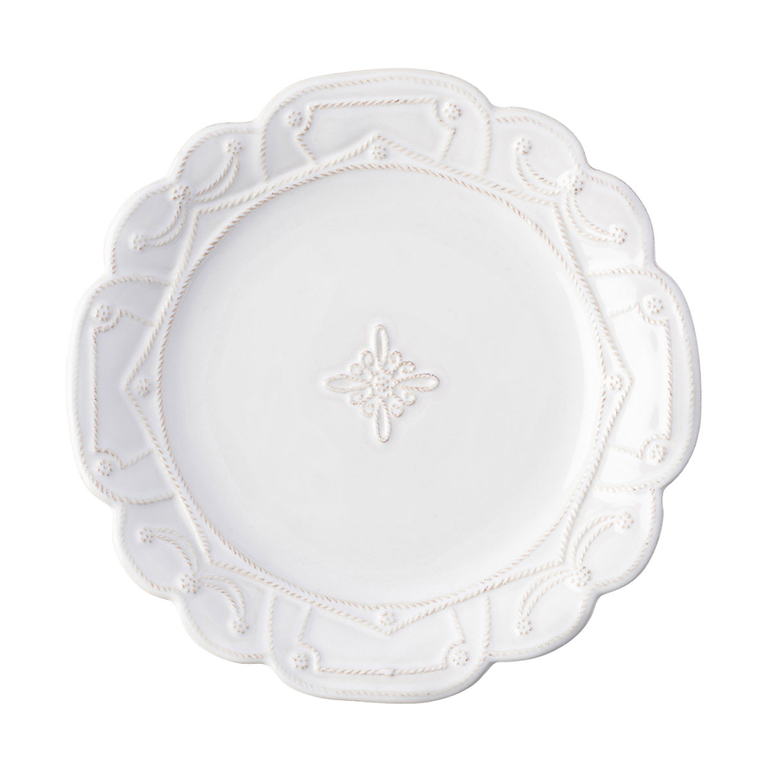A dinner plate with a geometric threaded pattern along the rim