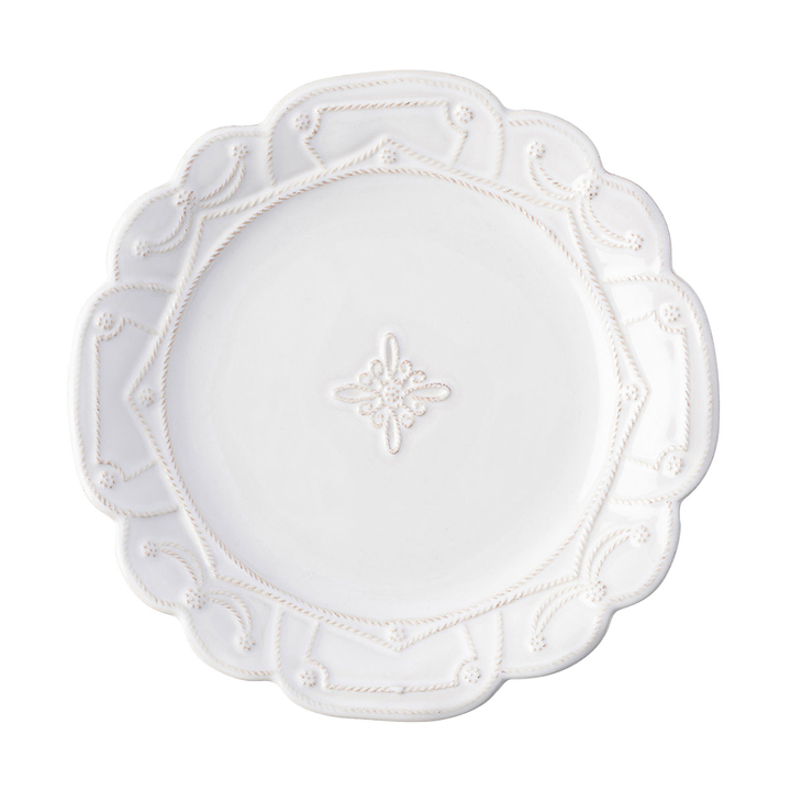 A dinner plate with a geometric threaded pattern along the rim