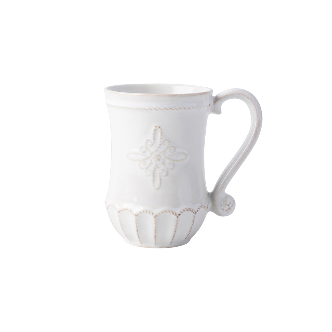 A white mug with an ornate threaded design and a curved decorative handle