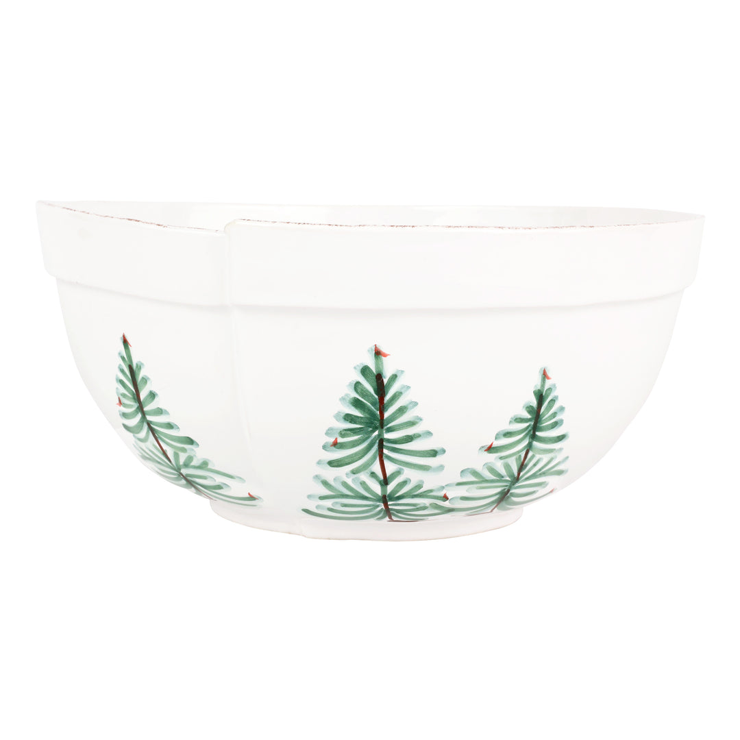 White bowl with green christmas tree design on a white background