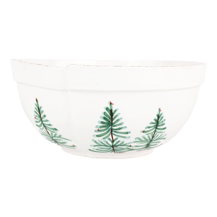 White bowl with green christmas tree design on a white background