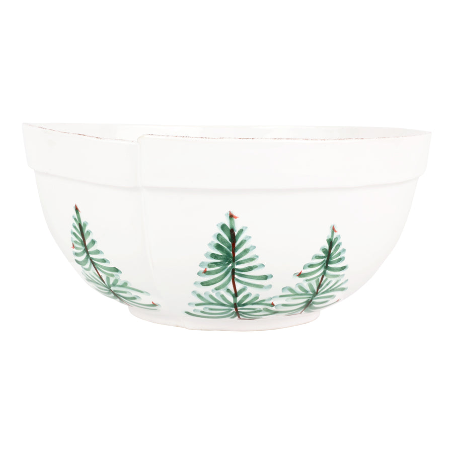 White bowl with green christmas tree design on a white background