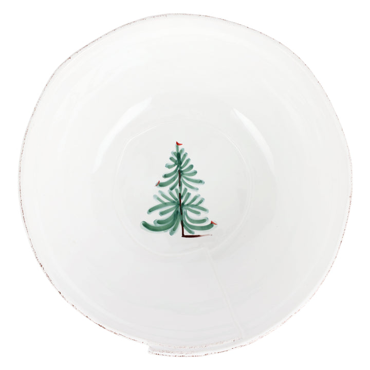 Round white plate with a green Christmas tree design on a white background