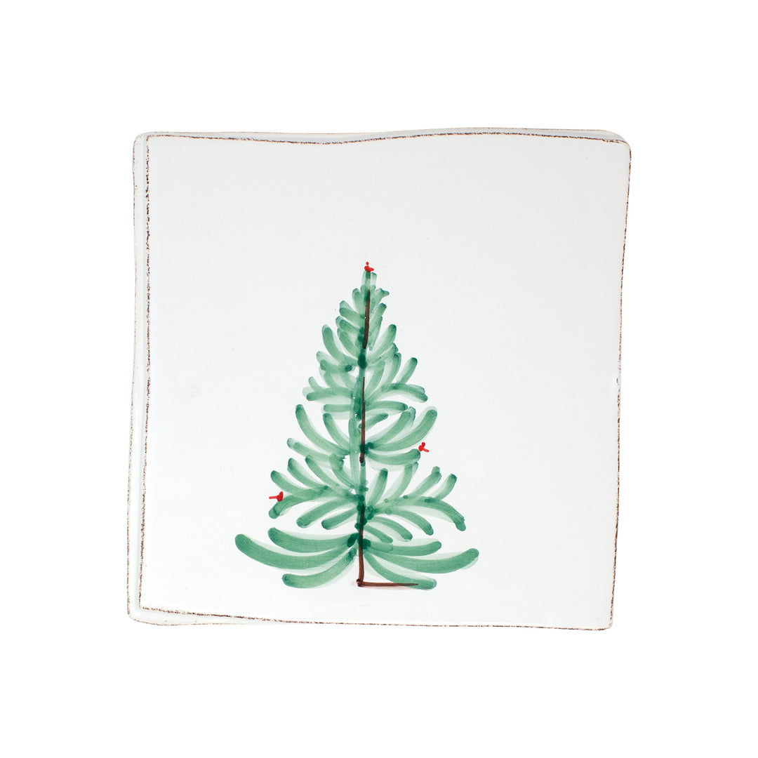 Square ceramic plate with a green Christmas tree design on a white background