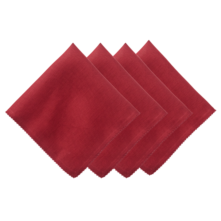 Four red napkins arranged in a row