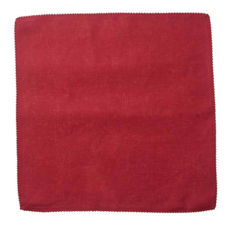 Red napkin with an embroidered edge 