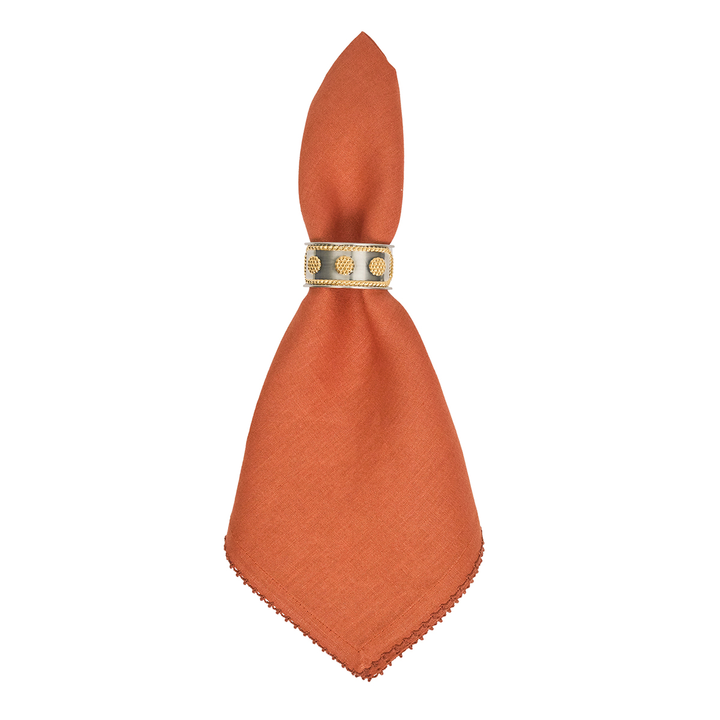 Orange napkin with a gold ring