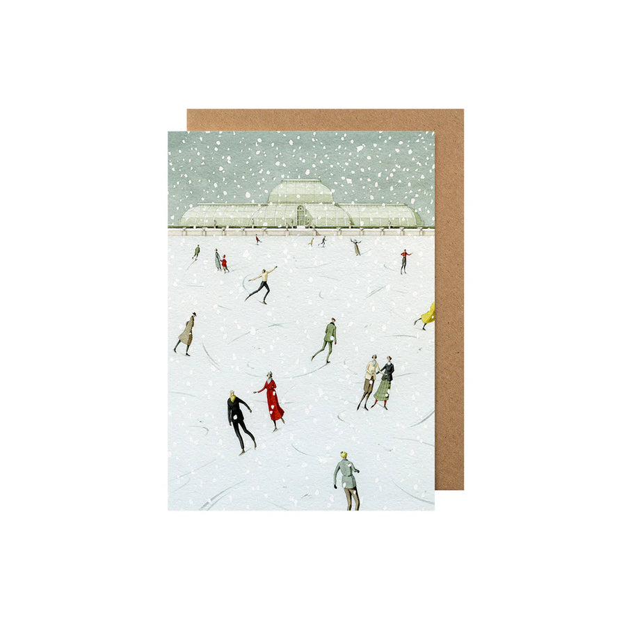 Greeting card with people skating on an ice rink in the snow on a brown kraft paper envelope