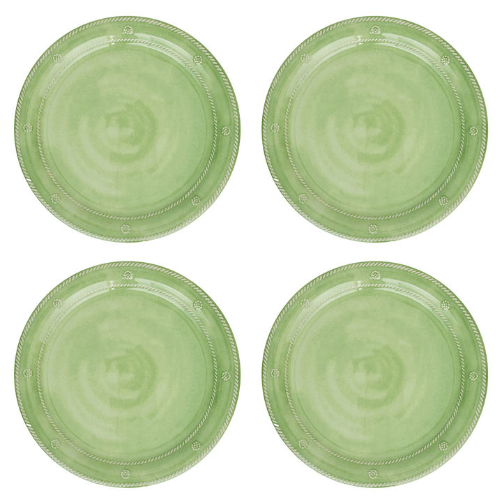 Four green ceramic plates with decorative edge