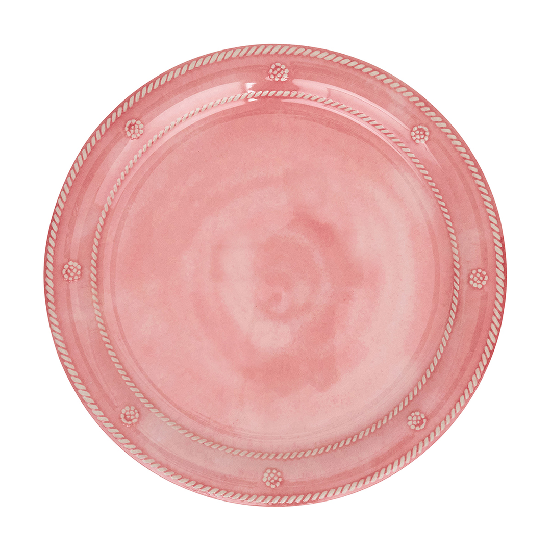 A round pink plate with a rope-style border and small raised decorative dots, shown from above