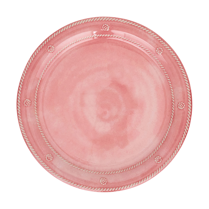 A round pink plate with a rope-style border and small raised decorative dots, shown from above