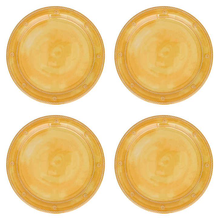 Four round gold plastic plates arranged in a 2x2 grid