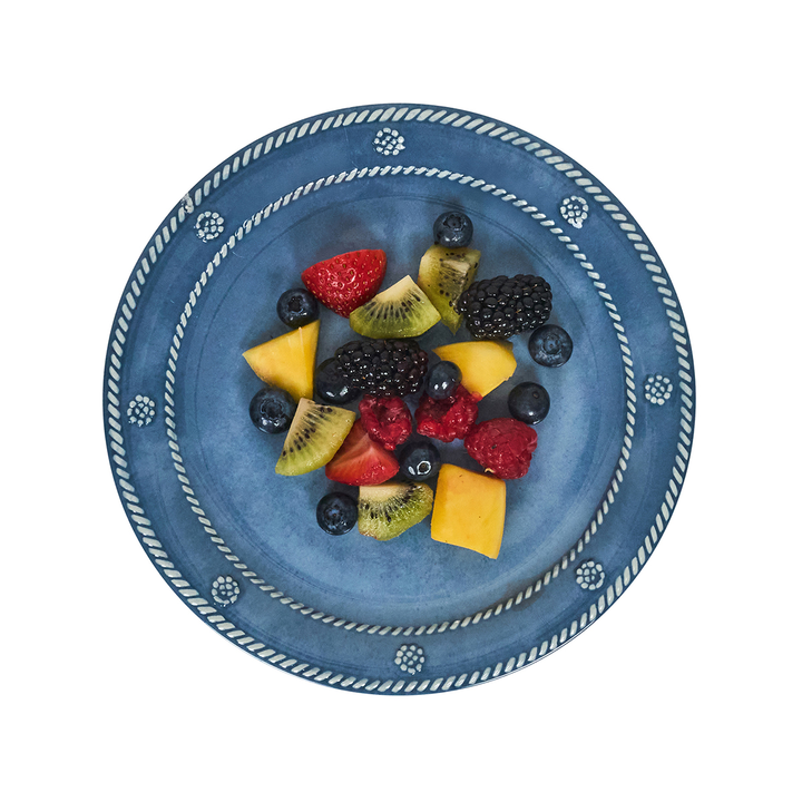 Blue decorative plate with a fruit salad 