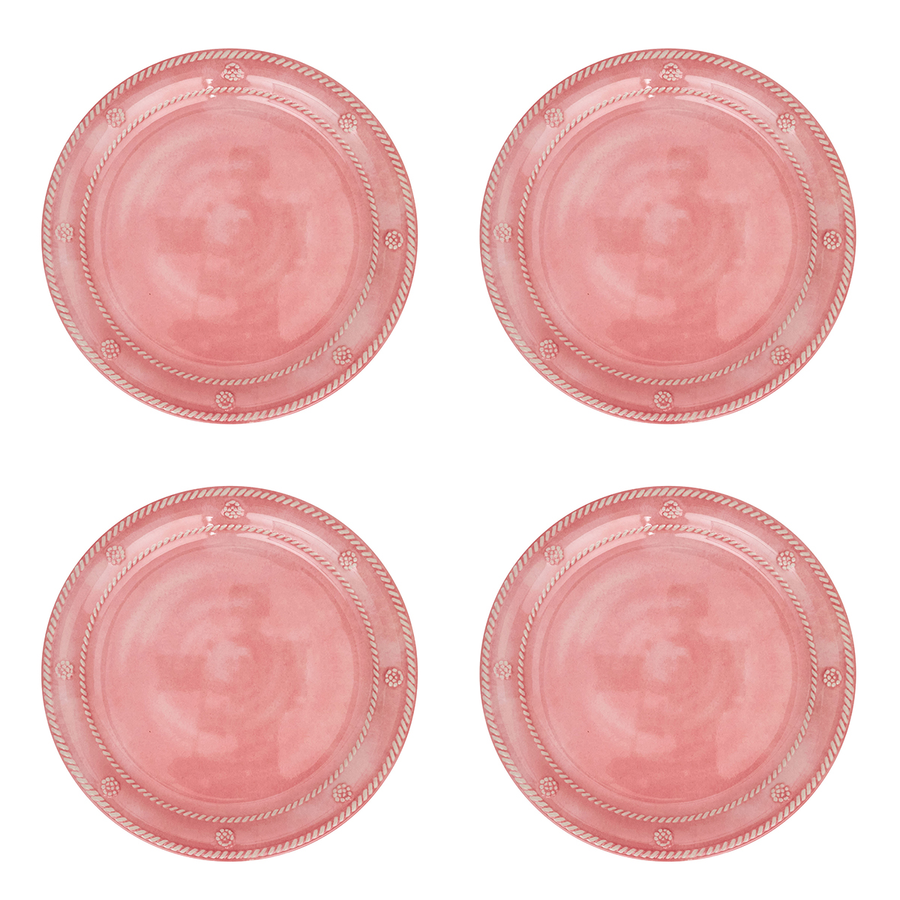 Four round pink plates arranged in a 2x2 grid on a plain white background. Each plate has a rope-style rim and small decorative motifs near the edge.
