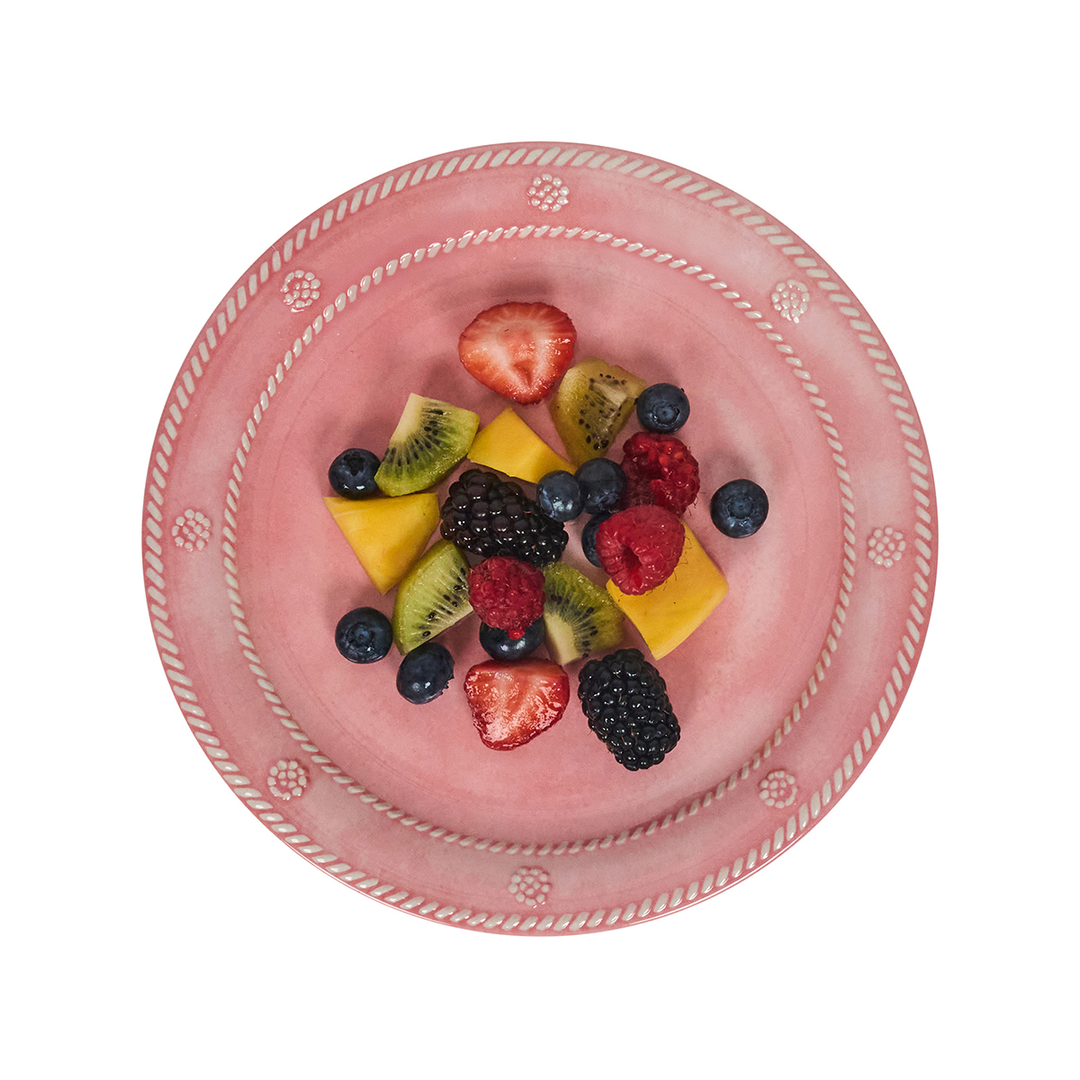Pink decorative plate with a mix of fruits 