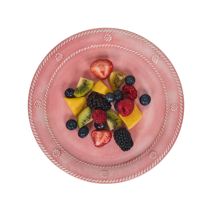 Pink decorative plate with a mix of fruits 