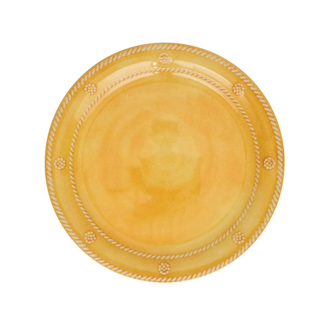 Yellow ceramic plate with decorative rim