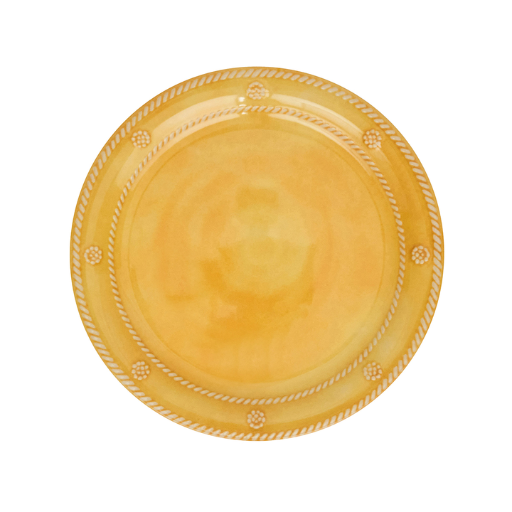 Yellow ceramic plate with decorative rim