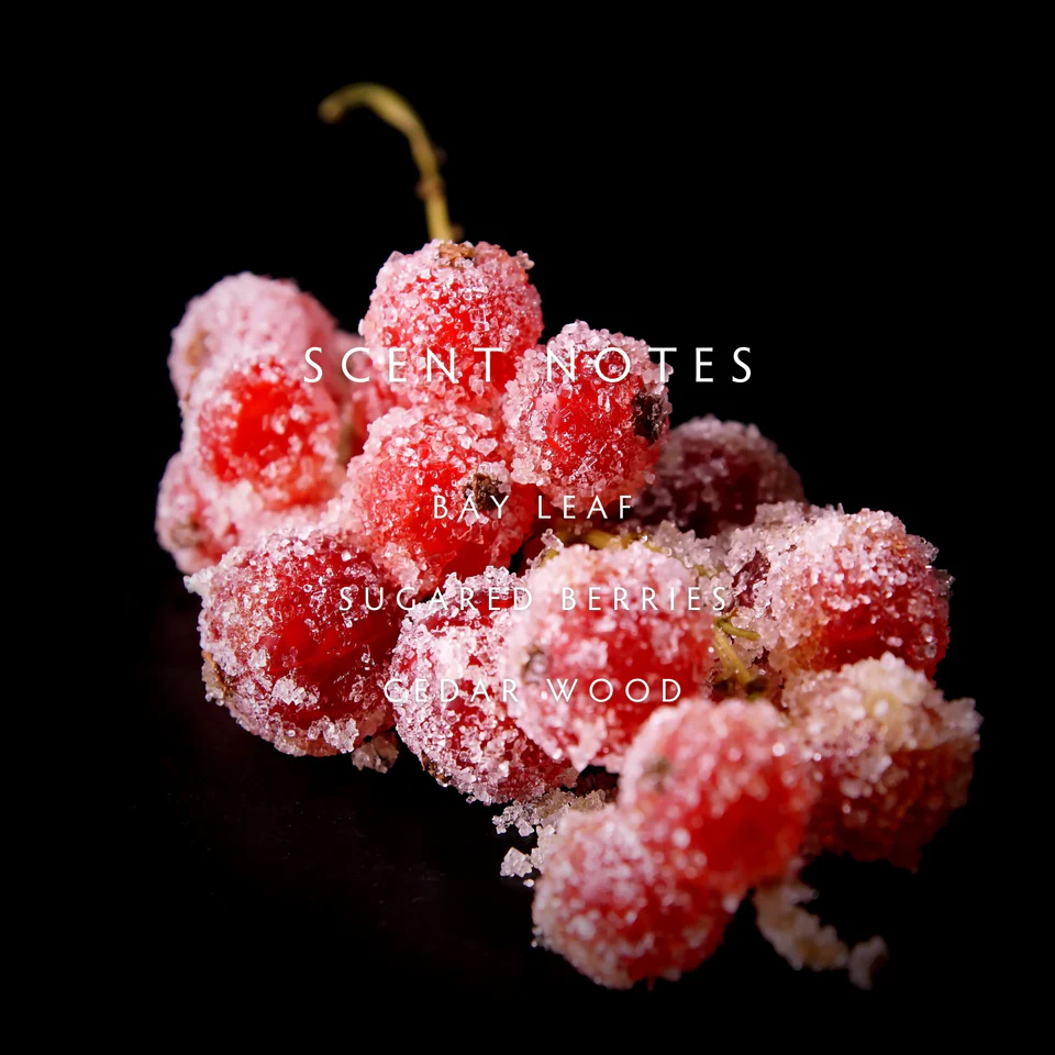 Frosted berries with scent notes text on a black background