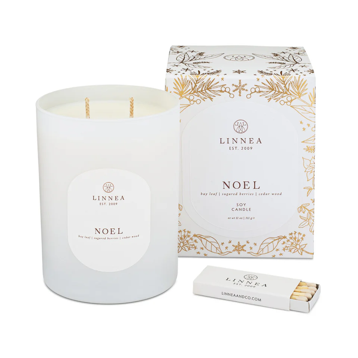 LINNEA 'Noel' candle with packaging and matches on a white background
