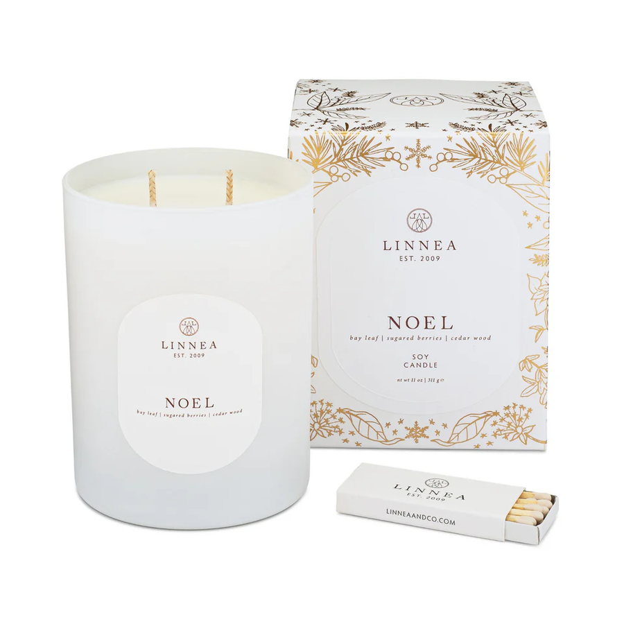 LINNEA 'Noel' candle with packaging and matches on a white background