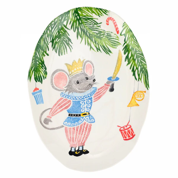 Decorative plate with a mouse king from the nutcracker ballet and christmas items on a white background