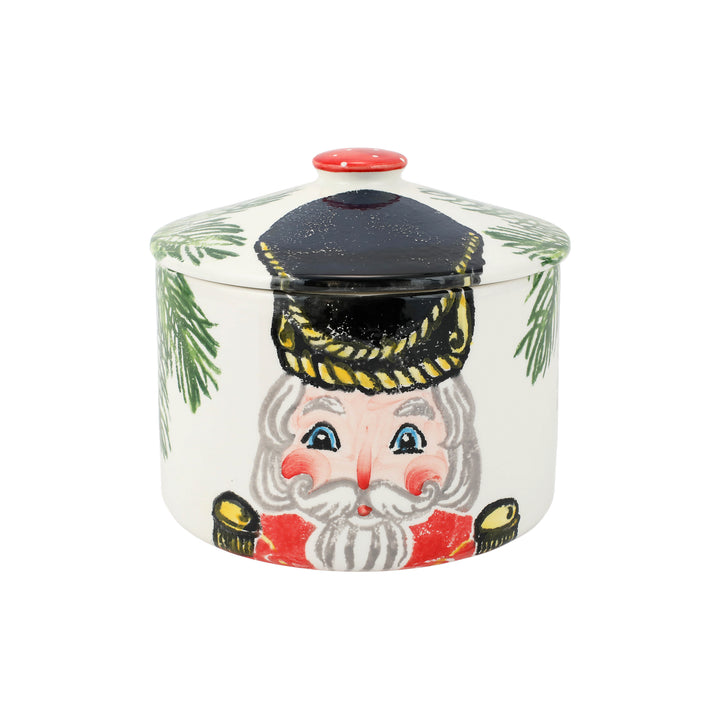 Decorative cookie jar with a nutcracker design on a white background