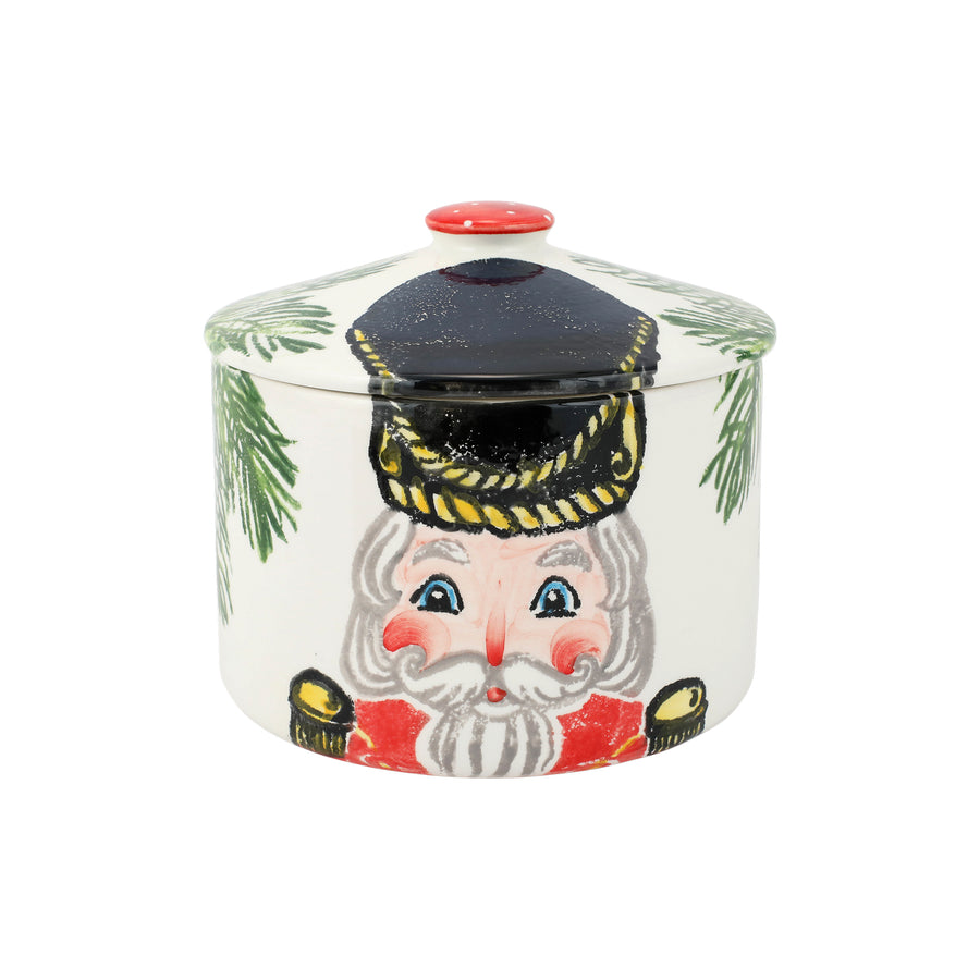 Decorative cookie jar with a nutcracker design on a white background