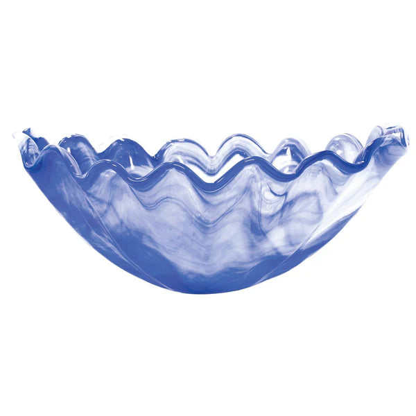 Blue glass bowl with wavy design on a white background