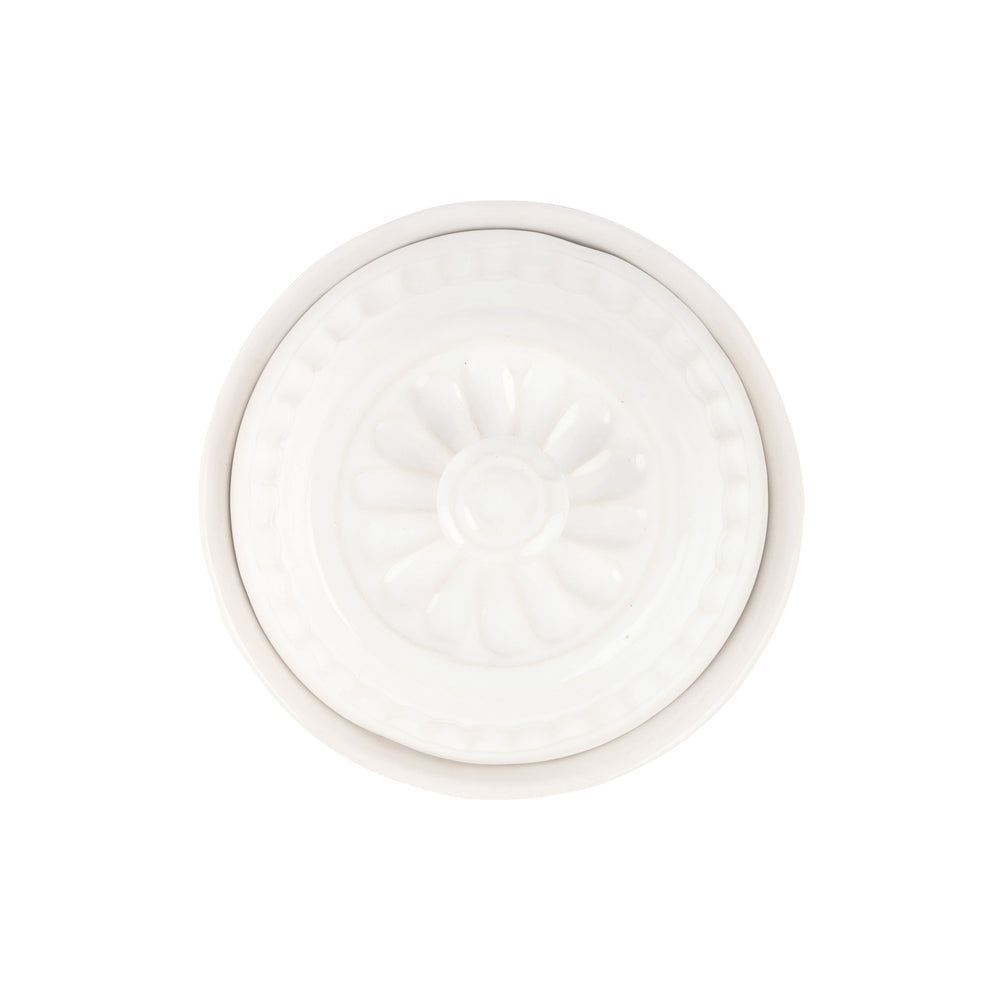 The top of a ceramic domed container 